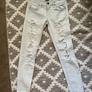 Distressed light wash jeggings